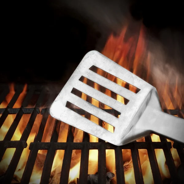 Spatula on the Flaming BBQ Grill — Stock Photo, Image