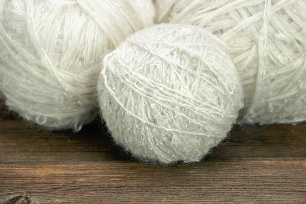 White Wool Rolls On Wood Background — Stock Photo, Image