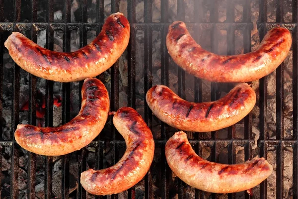 BBQ Bratwurst Sausages On The Hot Grill, Top View — Stock Photo, Image