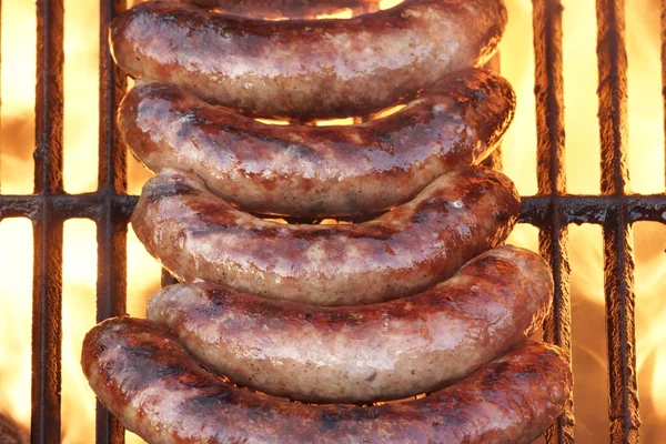 BBQ Bratwurst Sausages On The Hot Grill, Top View — Stock Photo, Image