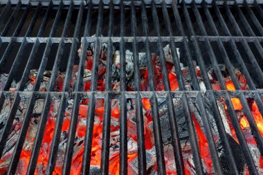 Emty Hot Barbecue Grill With Glowing Charcoal Background clipart