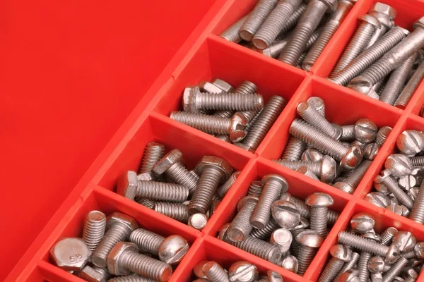 Different Bolts Collection In Red Plastic Box — Stock Photo, Image