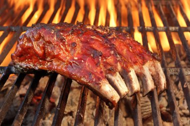 Pork Spare Ribs On The Hot Flaming  Barbecue Grill clipart