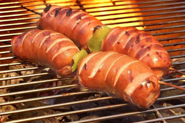 Fatty Sausages On The Hot Barbecue Flaming Charcoal Grill — Stock Photo, Image