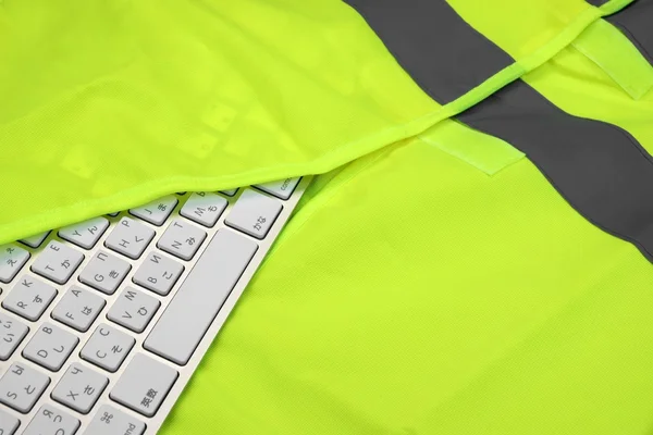 Keyboard In The Yellow Reflective Safety Vest — Stockfoto