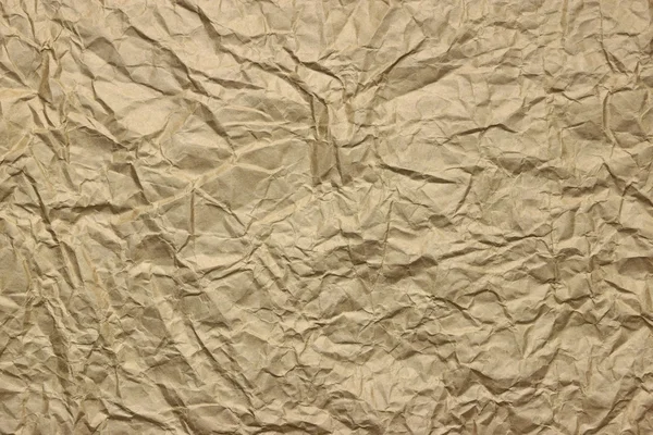 Närbild av grov gyllenbrun skrynkliga förpackningar pappersstruktur — Stockfoto