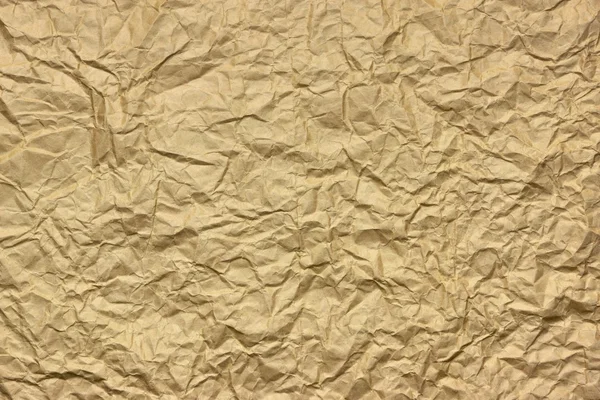 Gros plan de la texture rugueuse de papier d'emballage ridé brun doré — Photo