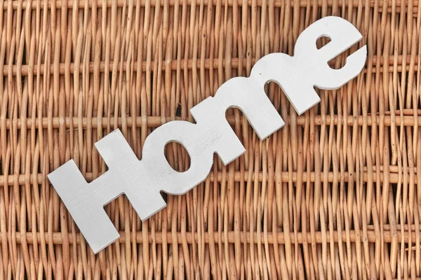 White Wood Sign Home On The Rustic Wicker Background — Stock Photo, Image