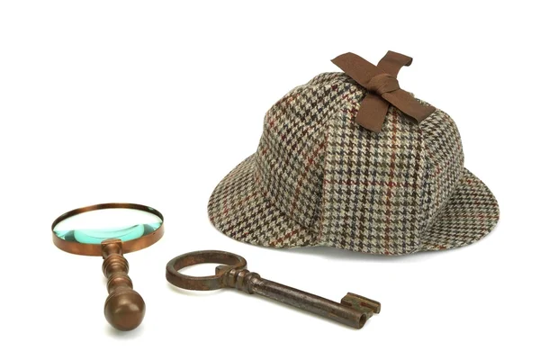 Sherlock holmes deerstalker cap, vintage lupe und ol — Stockfoto