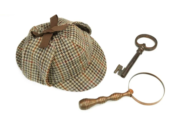 Sherlock holmes deerstalker cap, vintage lupe und ol — Stockfoto
