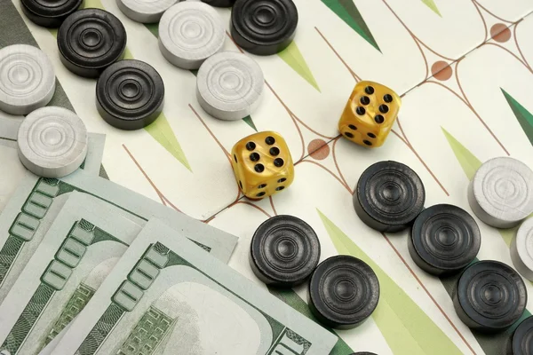 Backgammon Cardboard Playing Area, Wood Chips, Money And Two Dic — Stock Photo, Image