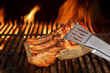Big Chop Of Pork Ribs On The Flaming BBQ Grill clipart
