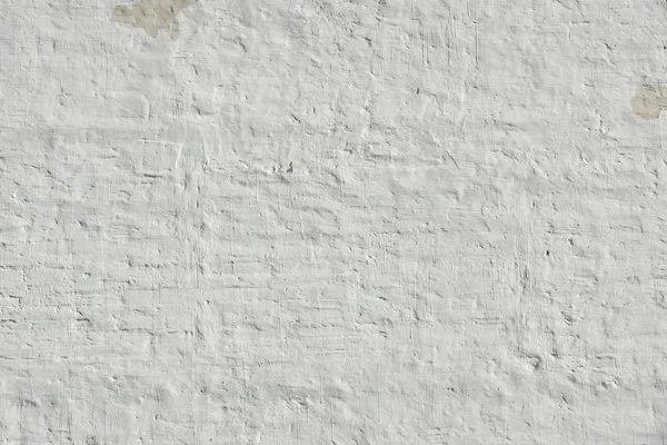 Weiß getünchte Backsteinwand uneben holprig rauen rustikalen Hintergrund — Stockfoto