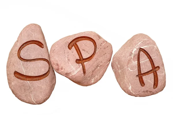 Sinal de SPA gravado nas pedras isoladas — Fotografia de Stock
