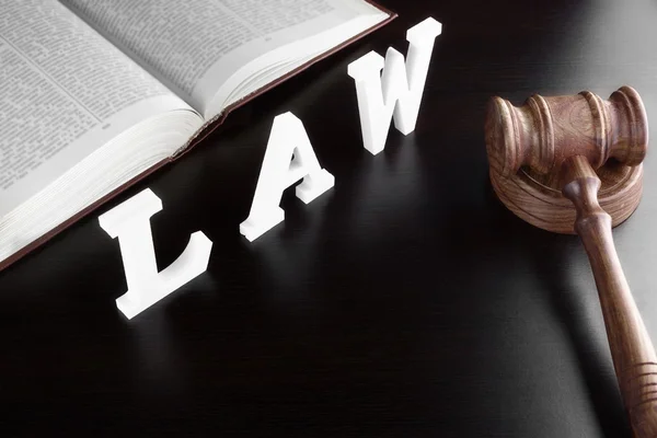 Judges Gavel, Red Book And Sign LAW On Black Table — 图库照片