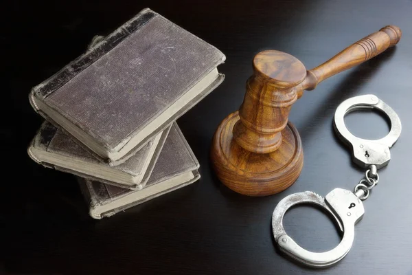 Judges Gavel, Handcuffs And Old Book On The Black Table — Stock Fotó