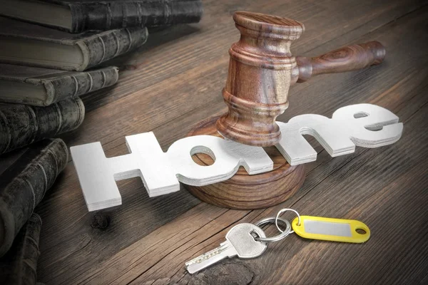 Sign Home, Key, Judges Gavel And Book On Wood Table — Stockfoto