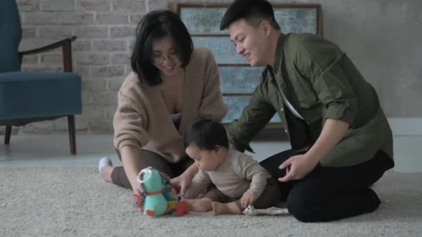 Happy Young Cheerful Asian Family Adult Mother Father Living Room — Stock Video