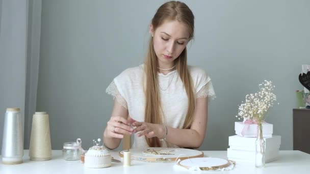 Young Girl Long Hair Sits Workspace Light Workshop Embroiders Beads — Stock Video
