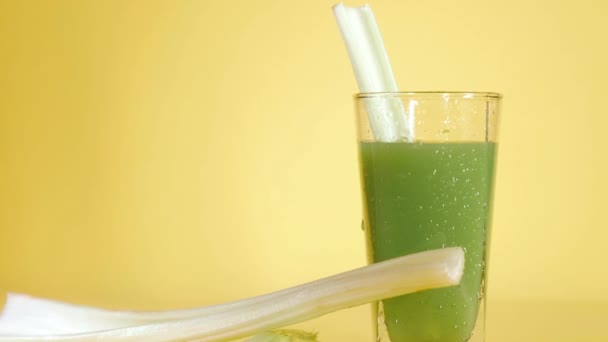 Delicious Organic Celery Juice Glass Yellow Colored Background Fresh Vegetables — Stock Video