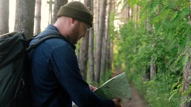 Man Traveling Foot Forest Paths Tourist Forest Holds Paper Map — Stock Video