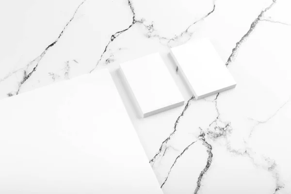 Photo of branding identity mock up on white marble. Template isolated on marble background. For graphic designers presentations and portfolios marble premium luxury mock-up