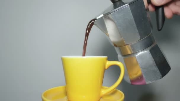 Pouring coffee in espresso cup.Cafe moka maker,caffeine addiction,morning breakfast in kitchen — Stock Video