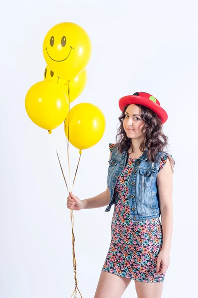 Nice funny girl with tellow balloons — Stock Photo, Image