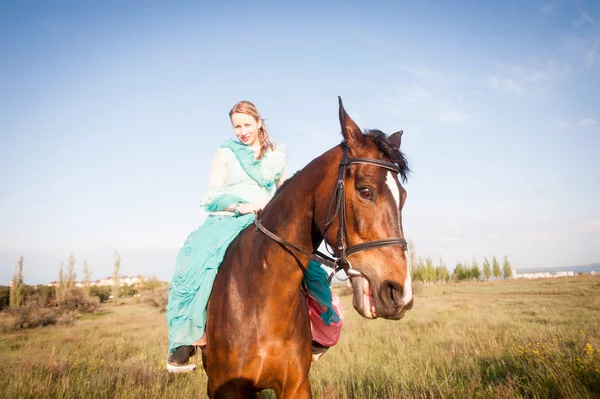 Horsewoman and blue sky — Stock Photo, Image