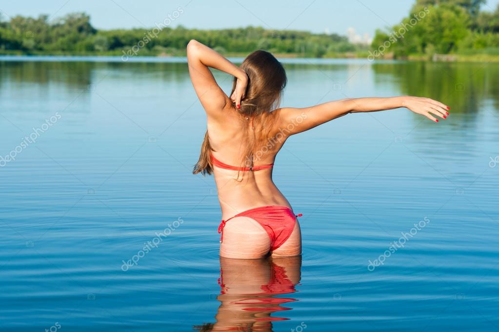 Bikini girl stretching. Stock Photo