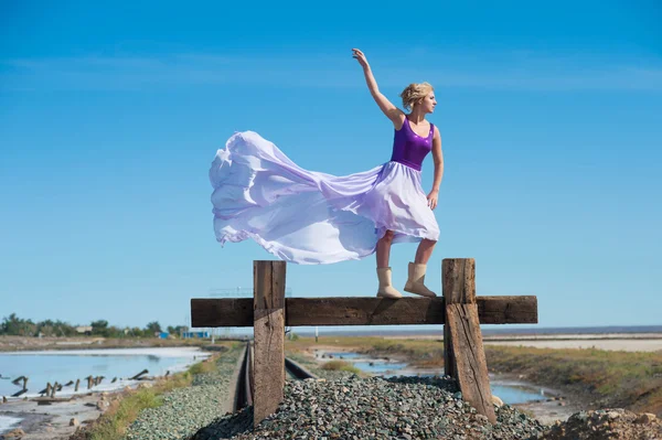 Woman in violet dress — Stock Photo, Image