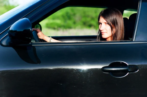 Young woman driving car — Stock Photo, Image