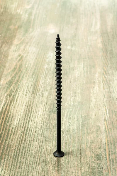 Black metal screw — Stock Photo, Image