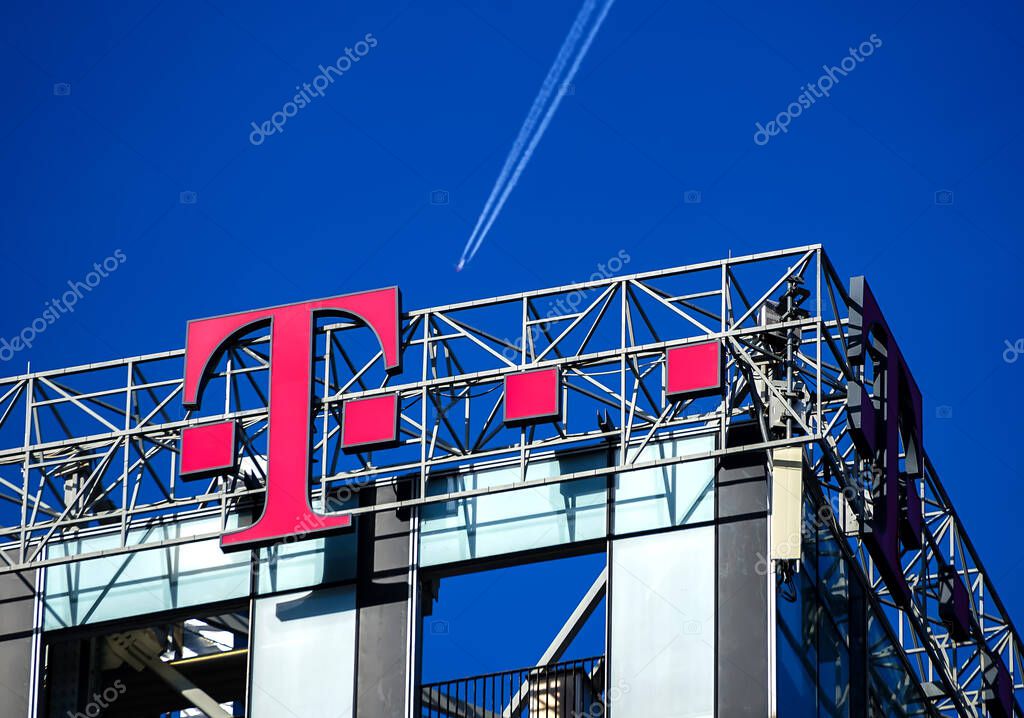 Bucharest, Romania -  January 21, 2021: A logo of Telekom, German telecommunications company, is displayed on top of the northern tower of the City Gate Towers situated in Free Press Square, in Bucharest, Romania.