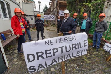 Bucharest, Romania - June 18, 2021: Municipal Consolidation Company employees protests because they were not paid for seven months after the General City Hall has not paid its contractual obligations.