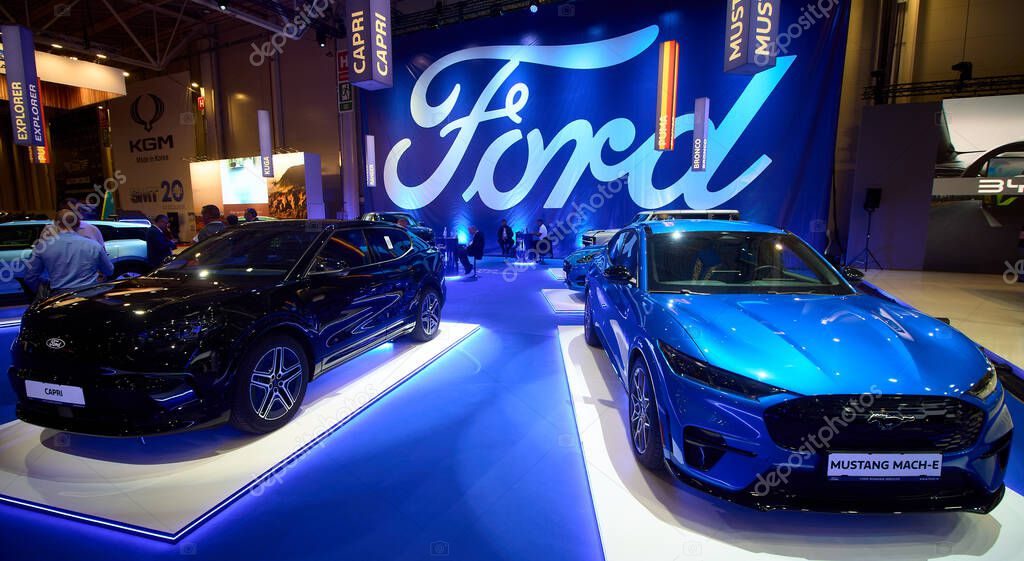 Bucharest, Romania. 7th Oct, 2025: A blue Ford Mustang Mach-E electric SUV is on display near the new Ford Capri electric SUV at the Ford stand during the Bucharest Auto Show and Accessories 2025.
