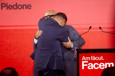 Bucharest, Romania. 19th Nov, 2025: Cristian Popescu Piedone (R), former mayor of Sectors 4 and 5, greets Daniel Baluta (L), mayor of Sector 4, during the launch of the candidacy of Baluta for general mayor of Bucharest.