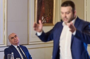 Bucharest, Romania. 20th Nov, 2025: Romanian Prime Minister Ilie Bolojan (L), president of the National Liberal Party (PNL) listens to Ciprian Ciucu (R), the mayor of Sector 6, PNL candidate for general mayor of Bucharest, presenting his 