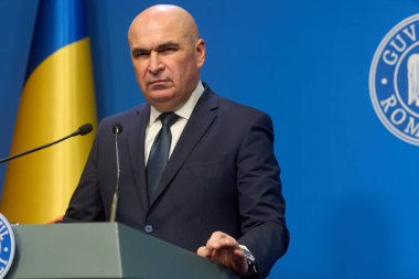 Bucharest, Romania. 21st Nov, 2025: Ilie Bolojan, Prime Minister of Romania, holds a press conference at Victoria Palace, the Romanian Government headquarters.