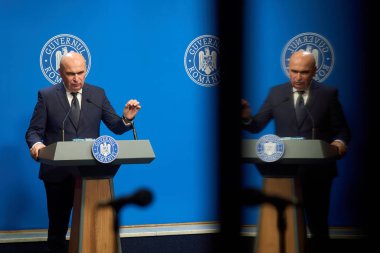 Bucharest, Romania. 21st Nov, 2025: Ilie Bolojan, Prime Minister of Romania, holds a press conference at Victoria Palace, the Romanian Government headquarters.