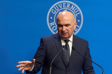 Bucharest, Romania. 21st Nov, 2025: Ilie Bolojan, Prime Minister of Romania, holds a press conference at Victoria Palace, the Romanian Government headquarters.