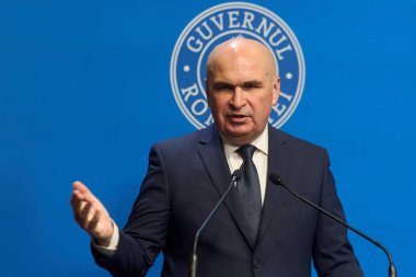 Bucharest, Romania. 21st Nov, 2025: Ilie Bolojan, Prime Minister of Romania, holds a press conference at Victoria Palace, the Romanian Government headquarters.