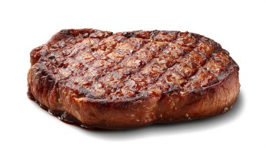 Thick cut beef ribeye steak seared to perfection with glazes on white background.