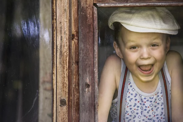 Boy looking at a window Royalty Free Stock Photos