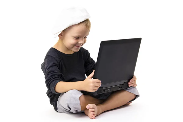 Cute boy playing laptop — Stock Photo, Image