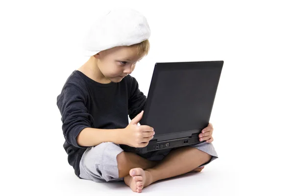 Cute boy playing laptop — Stock Photo, Image