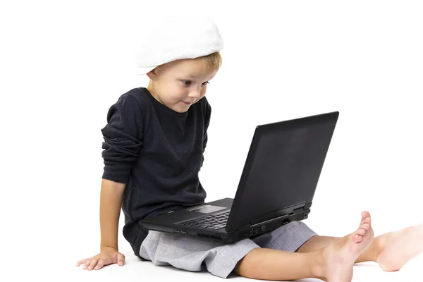 Cute boy playing laptop — Stock Photo, Image