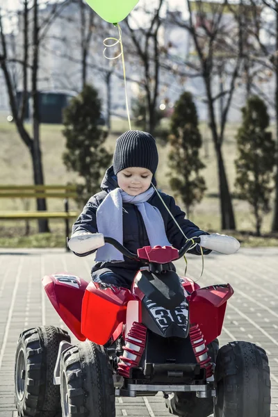 Boy riding in a car park — Stock Photo, Image