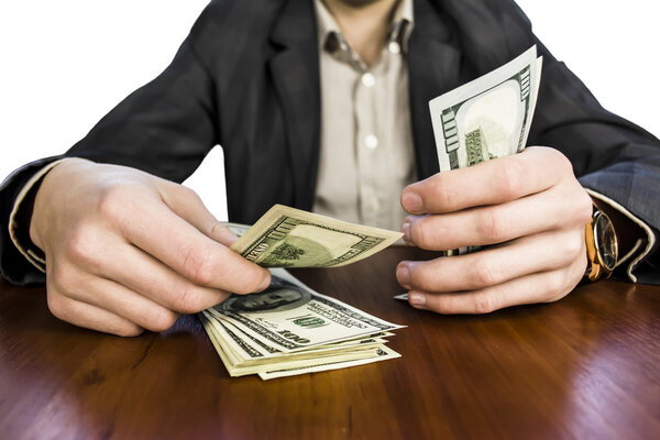 Бизнесмен считает деньги, доллары прибыли
