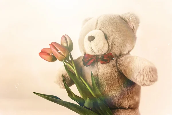 Orso giocattolo morbido con fiore — Foto Stock